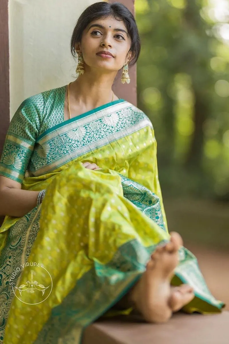 Enticing Parrot Soft Silk Saree With Blooming Blouse Piece