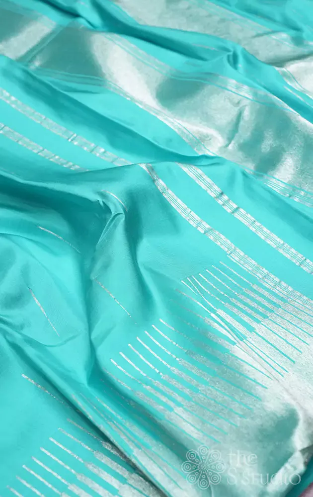 Sea green kanchi silk saree with silver zari seepu reku design border