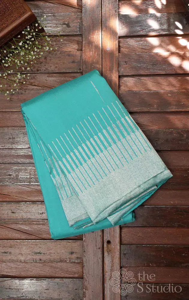 Sea green kanchi silk saree with silver zari seepu reku design border